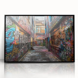 Large abstract wall art on acrylic, featuring swirling blue and gray tones, framed in black.