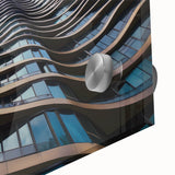 Large abstract wall art in vibrant orange and blue tones on acrylic glass, ideal for dining room ambiance.