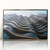 Mid-century modernist art depicting geometric shapes in gold and black on a framed acrylic print.