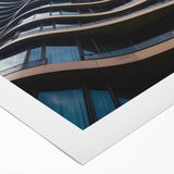 Art deco poster featuring a geometric pattern in gold and black on rolled canvas.