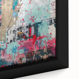 Close-up of textured black wall art with colorful abstract designs on a framed canvas, suitable for a large living room.