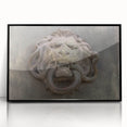 Large abstract wall art featuring swirling blue and gray tones on acrylic, framed in black.