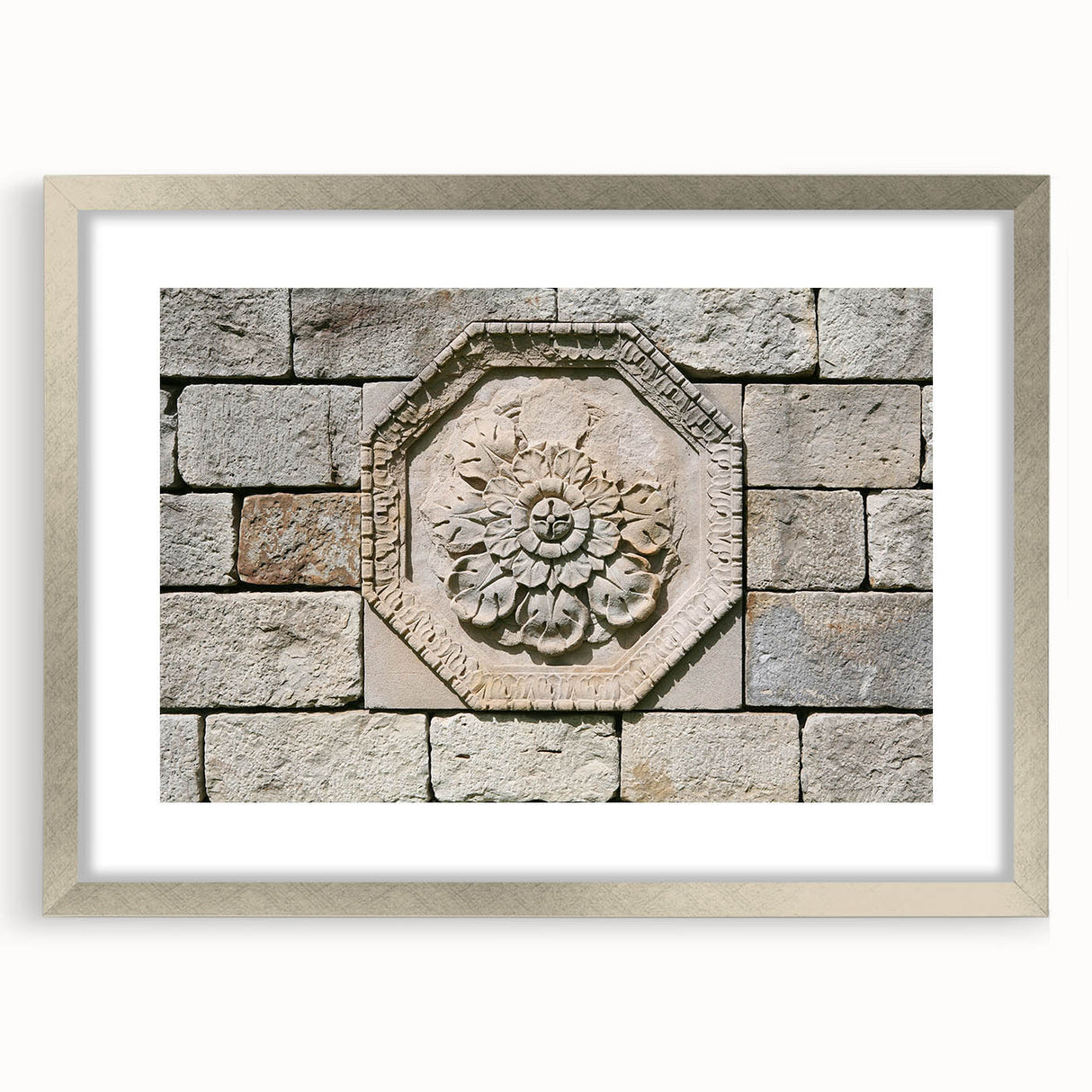 Textured abstract art print in muted gray and blue tones, displayed in a silver frame, suitable for bedroom wall decor.