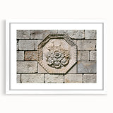 Abstract art print featuring swirling blue and grey tones on a white framed canvas.