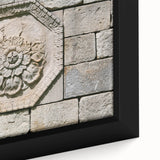 Close-up of black textured wall art with vibrant, colorful abstract patterns on a framed canvas, ideal for living room decor.