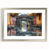 Textured art print featuring abstract patterns in muted gray and white tones, displayed in a silver frame.