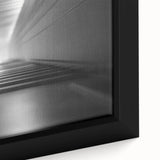 Close-up of black textured wall art with colorful accents on a large framed canvas, ideal for living room decor.