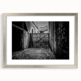 Textured abstract art print in muted gray and blue tones on framed canvas, suitable for modern bedroom decor.
