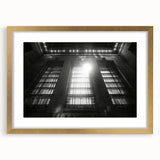 Textured abstract art print in muted gold and beige tones on a framed canvas, suitable for bedroom decor.