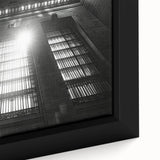 Close-up of extra large framed canvas featuring textured black wall art with colorful abstract patterns.