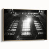 Framed canvas of a vintage landscape painting featuring muted earth tones and gold accents.