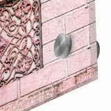 Large abstract wall art in vibrant orange and red tones on acrylic glass.