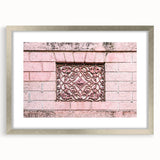 Textured abstract art print in muted gray and white, framed in silver, ideal for modern bedroom ambiance.