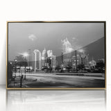 Large art print of a mid-century modernist cityscape in muted gray and blue tones on canvas.