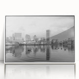 Art deco poster of a stylized cityscape in muted blue and gray tones on canvas.