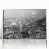 Art deco poster featuring a stylized cityscape in muted gold and navy tones on canvas.