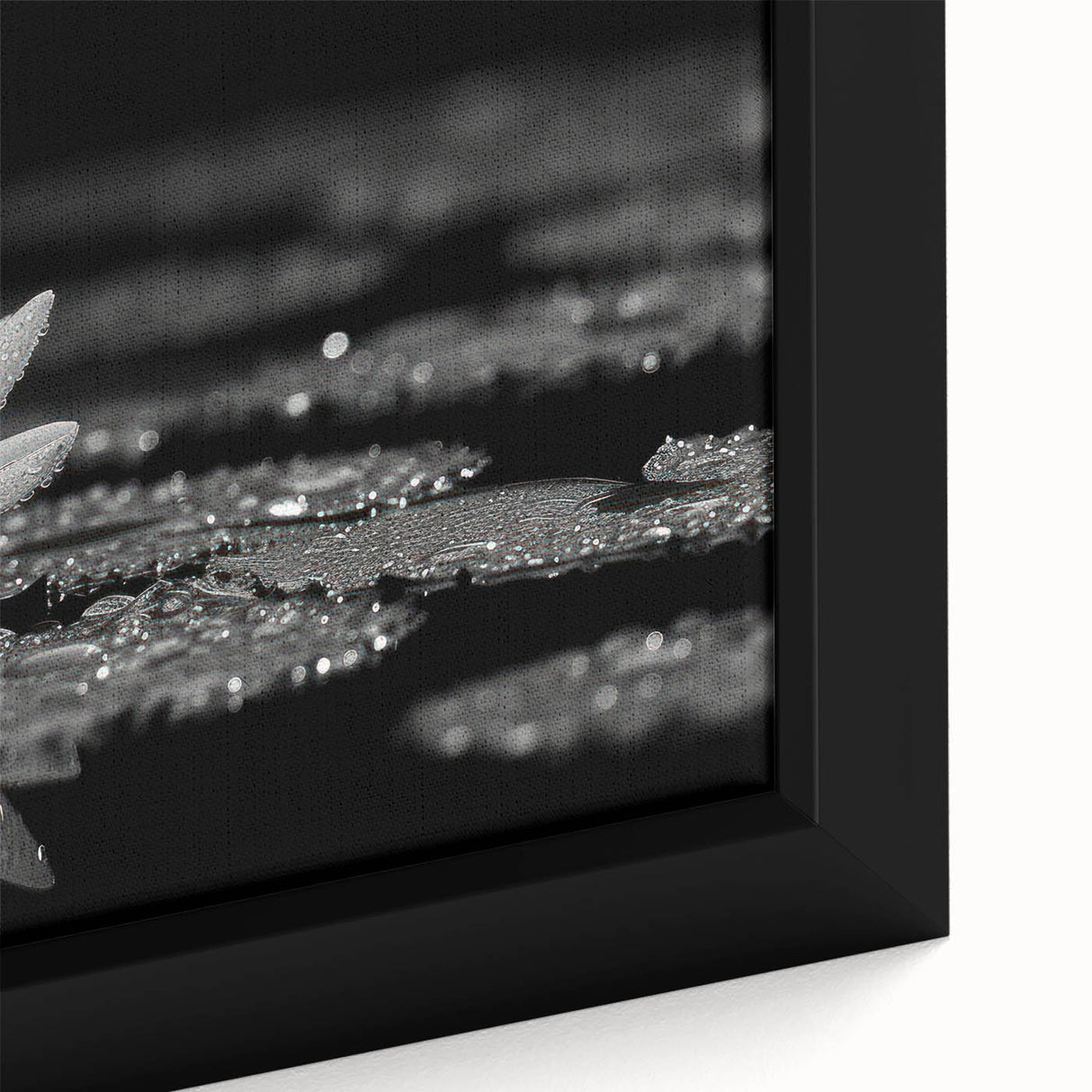 Vibrant close-up of a floral canvas print showcasing intricate details of colorful flowers and lush green leaves, perfect for home decor enhancement.