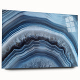 Large abstract wall art featuring swirling blue and gray tones on canvas, suitable for bedroom or dining room decor.