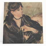 Large black and white abstract art on canvas, featuring dynamic brush strokes.