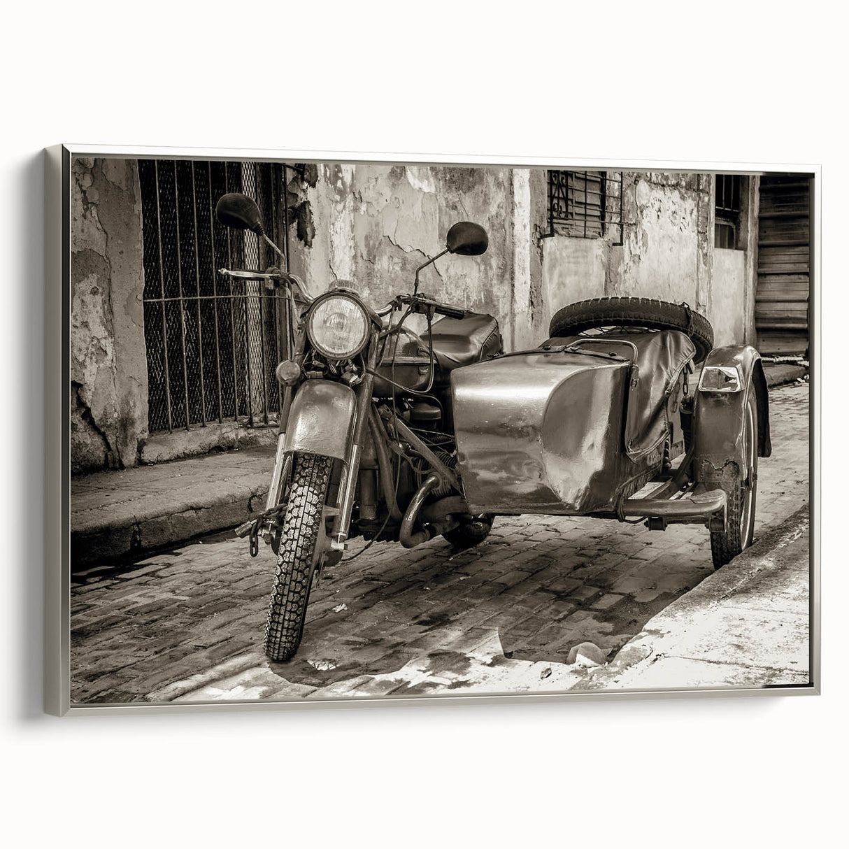 Landscape painting of colorful vintage cars on a black background, printed on canvas.