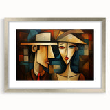 Framed abstract figurative wall art in a silver frame, showcasing vibrant colors and dynamic shapes, perfect for modern decor.