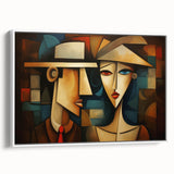 Framed wall art showcasing an abstract figurative design with vibrant colors and unique shapes, displayed from a side view against a white background.