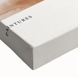 Close-up of a stretched canvas showcasing an abstract minimalist design with soft pastel colors, perfect for modern home decor and wall art collection.