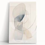 Abstract minimalist wall art design on stretched canvas, showcasing soft hues of blue and beige, leaning against a light-colored wall, perfect for modern decor.