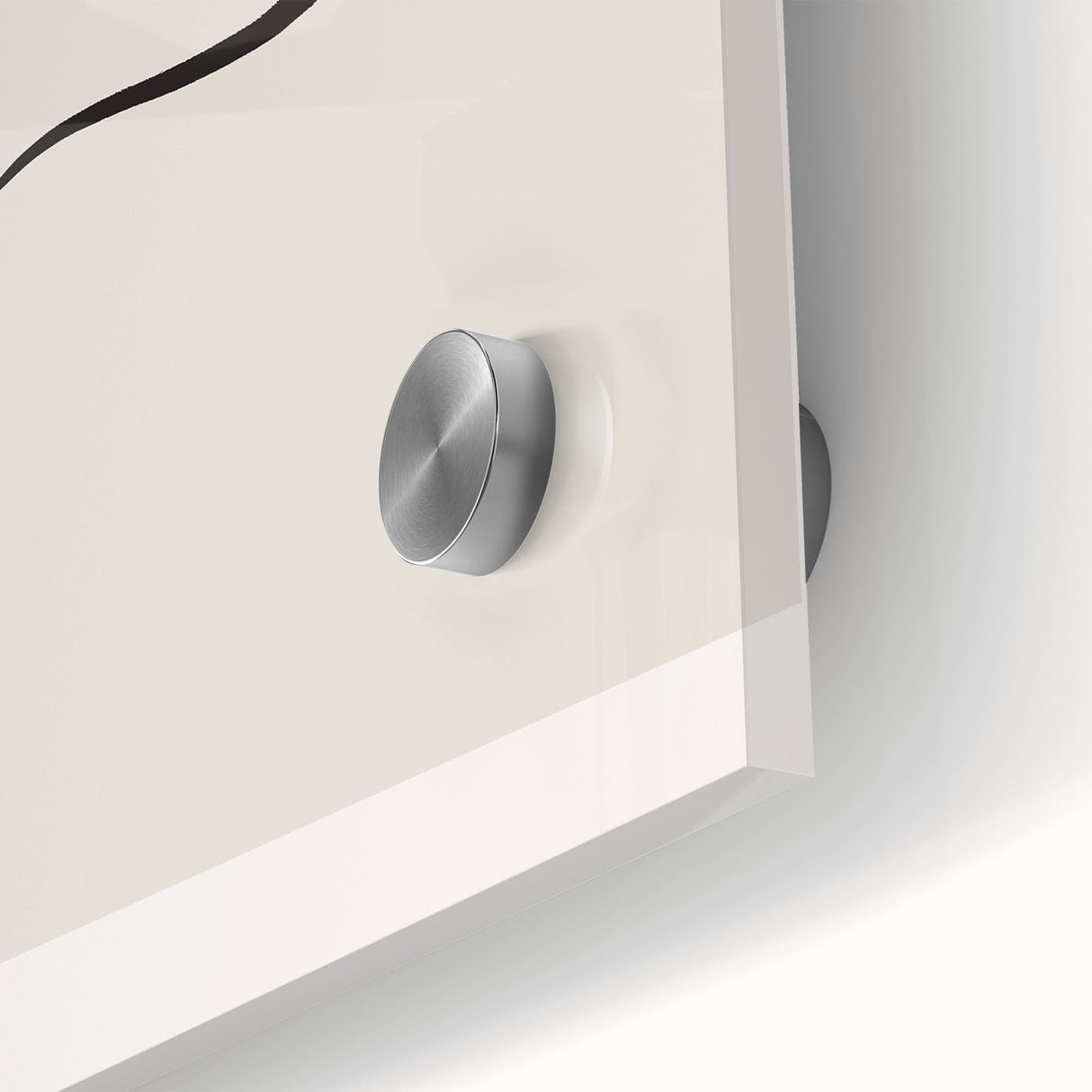 Close-up of an abstract minimalist wall art piece showcasing a collection of geometric shapes and soft pastel colors on acrylic glass, emphasizing modern design aesthetics.