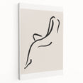 Stretched canvas wall art showcasing an abstract minimalist design with soft neutral tones, displayed from a side view, ideal for modern home decor.