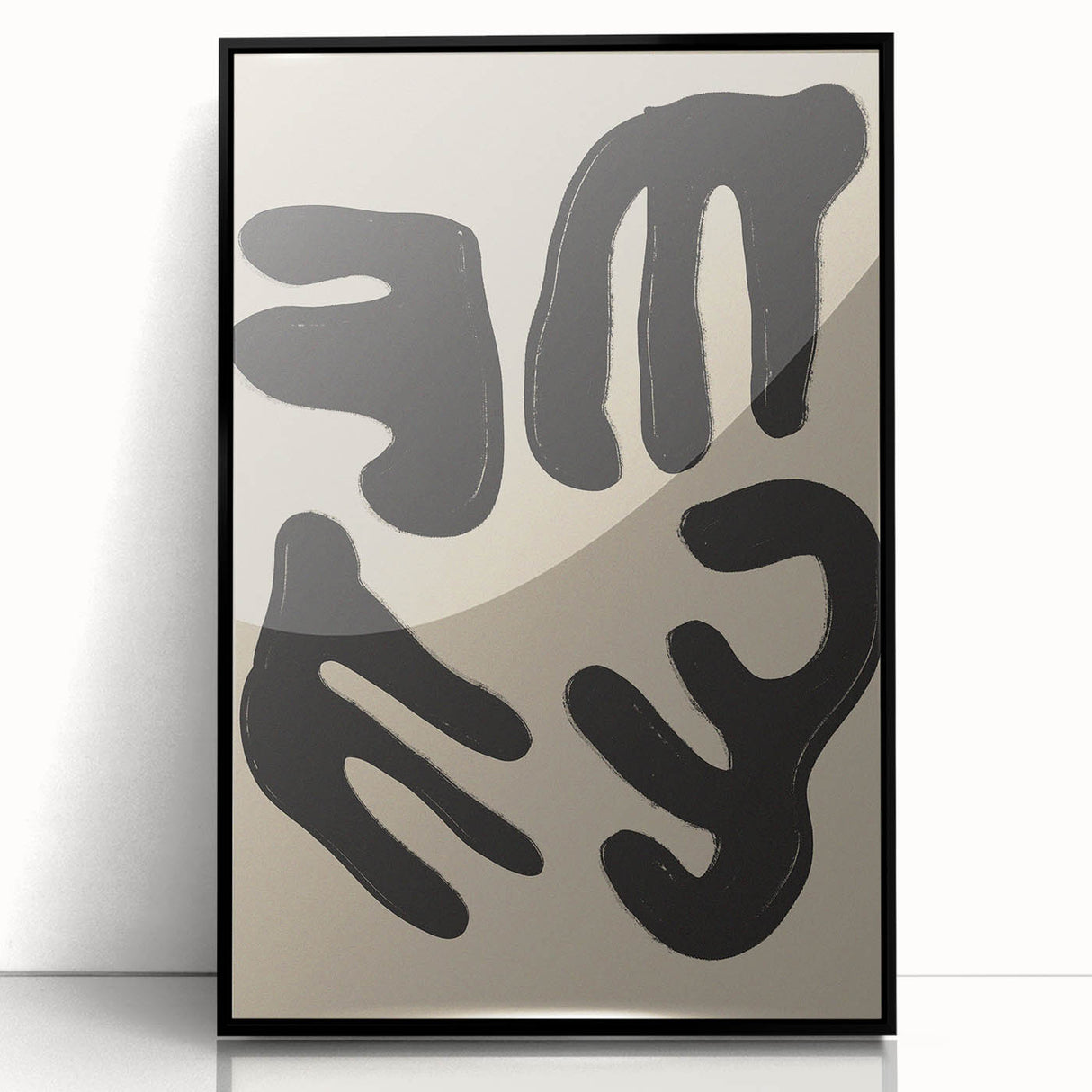 Framed abstract minimalist wall art design featuring bold black shapes on a white background, showcasing modern elegance and sophistication.