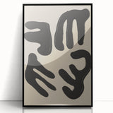 Framed abstract minimalist wall art design featuring bold black shapes on a white background, showcasing modern elegance and sophistication.