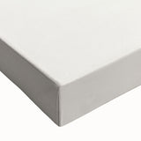 Close-up of a stretched canvas featuring an abstract minimalist design with soft pastel colors and geometric shapes, ideal for modern home decor.