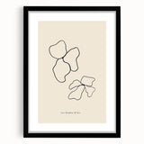 Abstract minimalist wall art collection framed in black, showcasing a sleek design with a white mat, perfect for modern decor.
