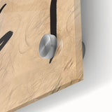 Close-up of an abstract minimalist wall art piece featuring vibrant colors and geometric shapes, displayed in an elegant acrylic glass frame, enhancing modern decor aesthetics.