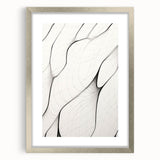 Minimalist abstract wall art framed in silver, showcasing a sleek design with a white mat, perfect for modern home decor and artistic displays.