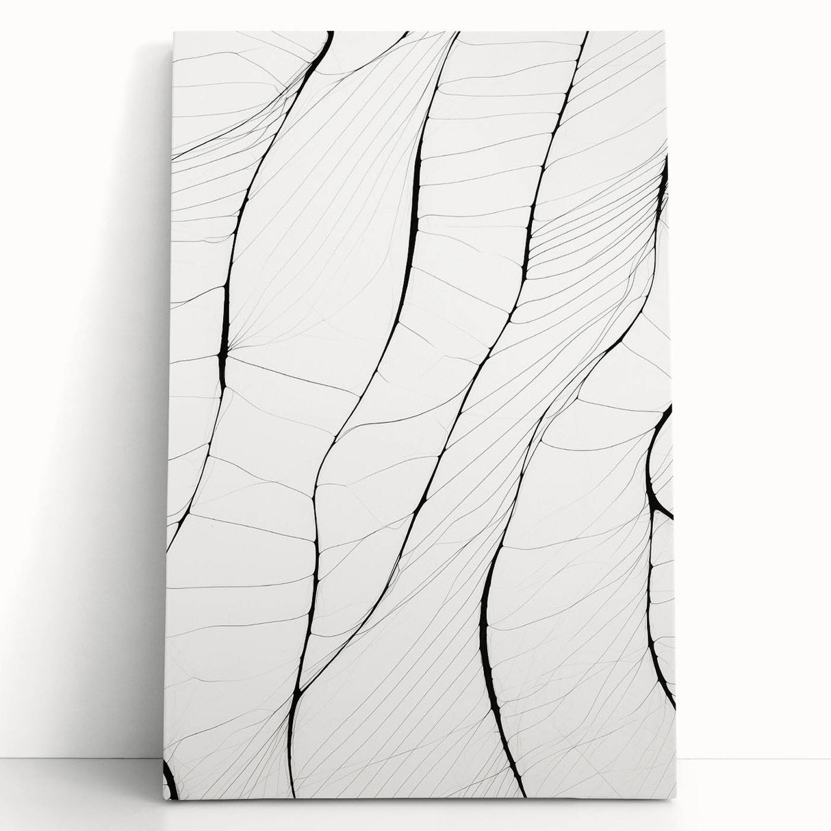 Abstract minimalist wall art collection featuring a stretched canvas design with soft neutral colors, elegantly leaning against a wall, perfect for modern home decor.
