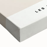 Close-up of a stretched canvas showcasing an abstract minimalist design in soft beige and gray tones, ideal for modern home decor. Perfect for adding elegance to living spaces.