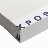 Close-up of an abstract minimalist wall art design on stretched canvas, showcasing soft earth tones and geometric shapes, ideal for modern home decor.