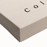 Close-up of a stretched canvas showcasing an abstract minimalist design with soft pastel colors and geometric shapes, ideal for modern home decor and artistic interiors.