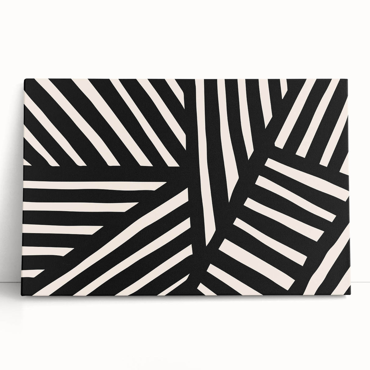 Abstract minimalist wall art collection featuring a stretched canvas design with soft pastel colors and geometric shapes, leaning against a neutral wall, perfect for modern decor.