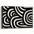 Abstract minimalist wall art design featuring a black-framed canvas with geometric shapes, enhancing modern home decor. Ideal for contemporary living spaces.