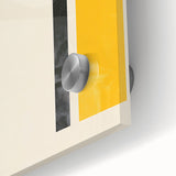 Close-up of an abstract minimalist wall art piece featuring a vibrant color palette and geometric shapes, displayed under acrylic glass for a sleek finish.