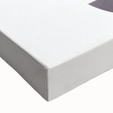 Close-up of a vibrant abstract minimalist design on stretched canvas, showcasing swirling blue and gold patterns, perfect for modern home decor.