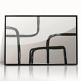 Framed abstract minimalist wall art featuring a sleek black design, elegantly displayed in a modern setting, enhancing contemporary decor aesthetics.