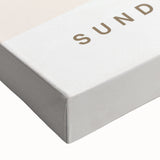 Close-up of a stretched canvas featuring an abstract minimalist design in soft earth tones, perfect for modern home decor, showcasing smooth textures and artistic detail.