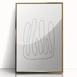 Framed minimalist wall art featuring an abstract design in gold and white, showcasing elegant lines and geometric shapes for modern decor.