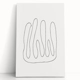 Abstract minimalist wall art collection featuring a stretched canvas with soft beige and gray tones, elegantly leaning against a neutral wall, perfect for modern decor.