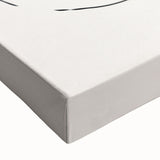 Close-up of a stretched canvas featuring an abstract minimalist design with soft pastel colors and geometric shapes, perfect for modern decor.