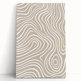 Minimalist abstract wall art collection on stretched canvas in soft pastel colors, leaning against a wall, perfect for modern home décor.